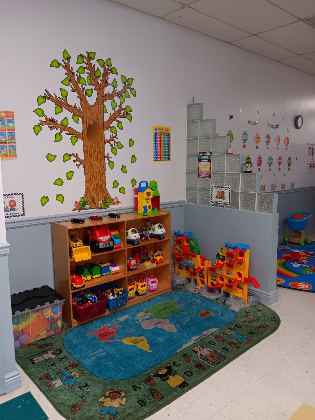Wantagh classroom with Sesame Street wall decor and toy shelves